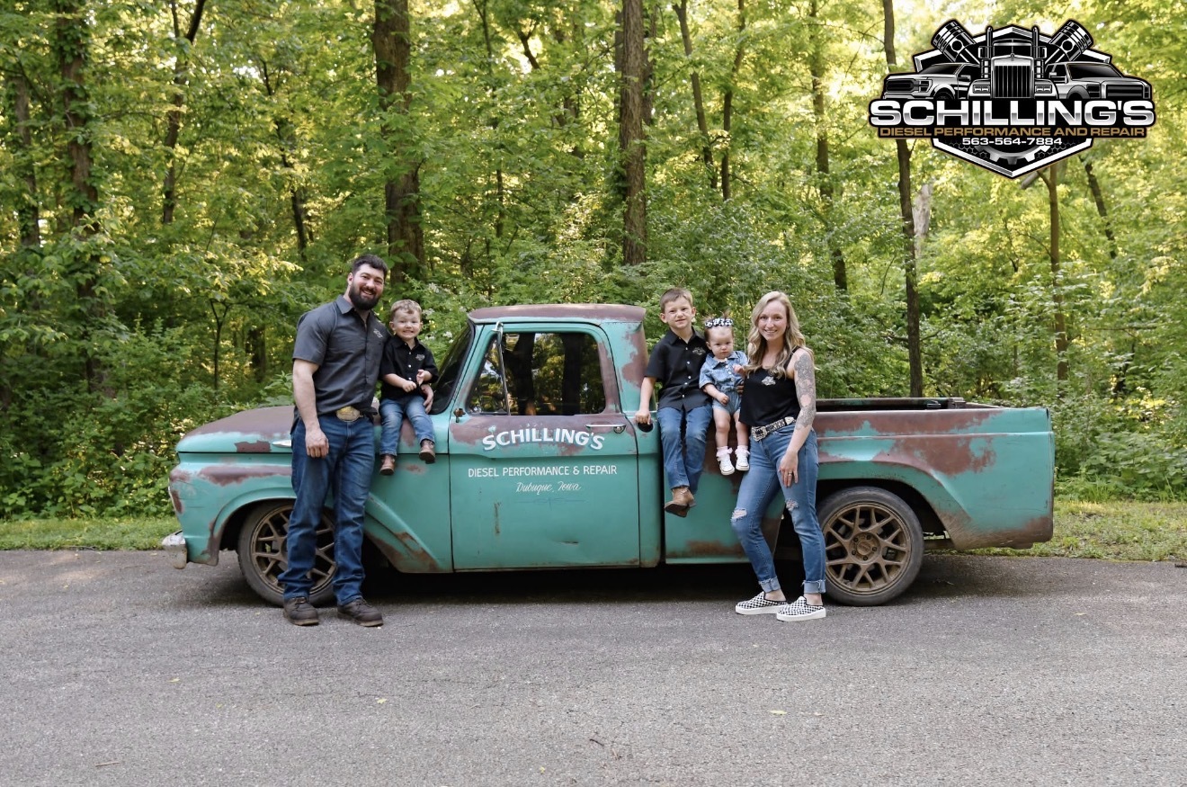 The Schilling family with their turquoise vintage pickup