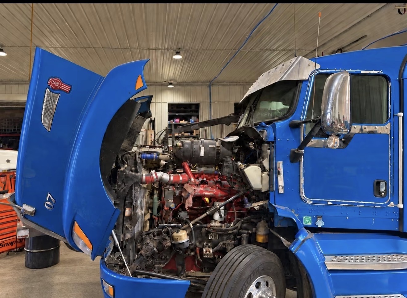 Blue Class 8 truck undergoing service in the Schilling’s shop